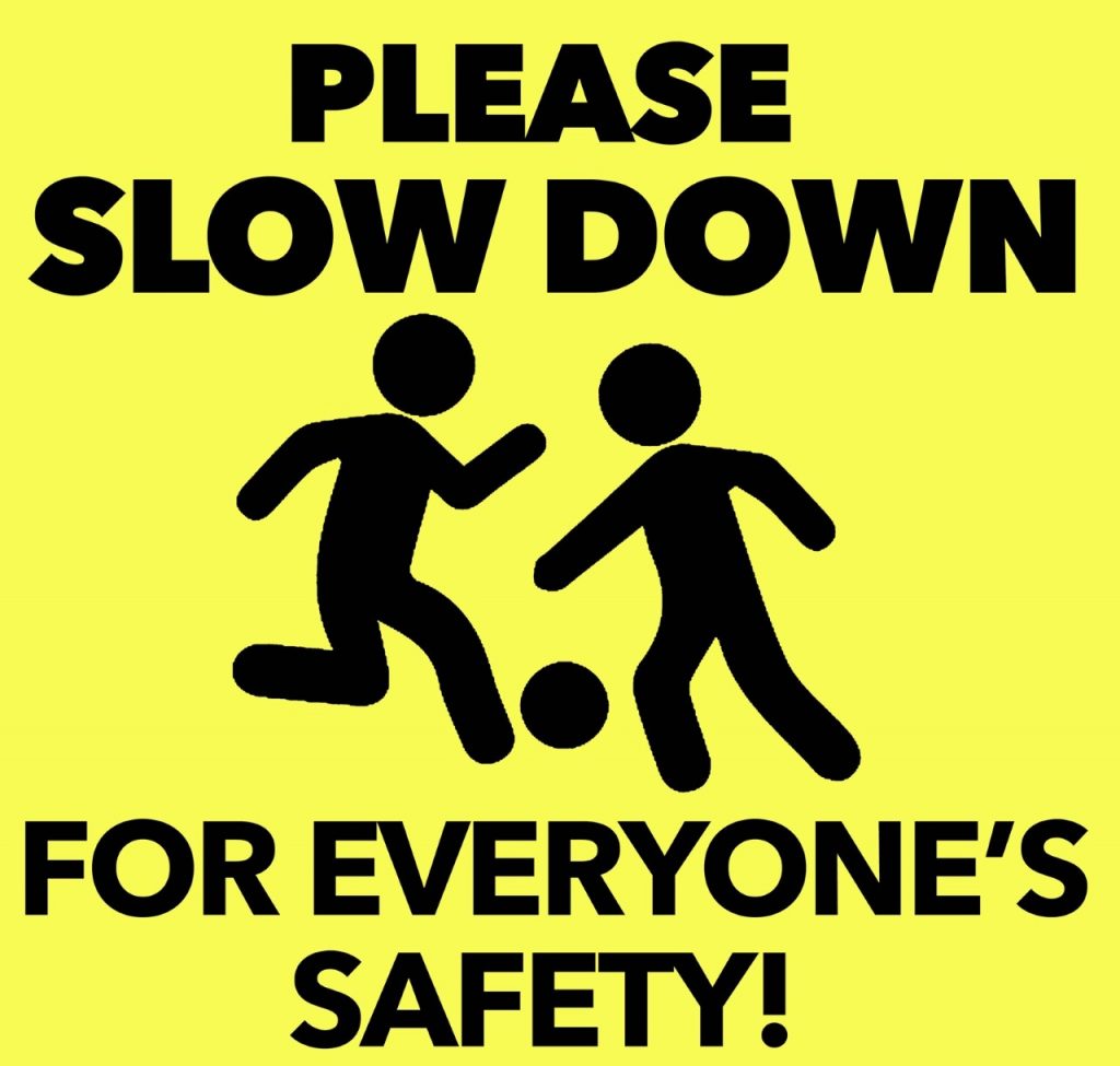 please slow down for everyone's safety sign